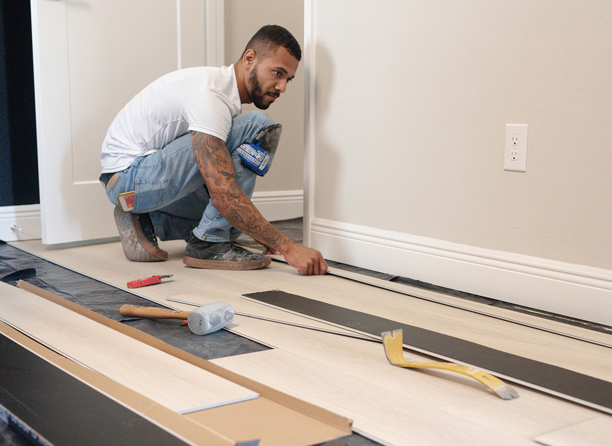 G. Fried installer measuring floors